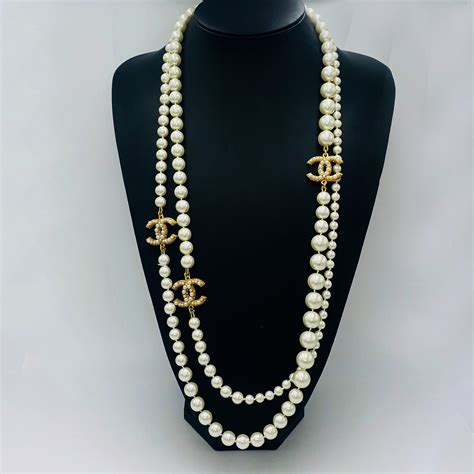 necklace chanel logo|chanel long pearl logo necklace.